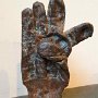 B. Amore, "Standing Glove (Found Around Town Series)," glove cold cast in bronze, marble, 9 x 5 x 4.5 inches. Photo credit B. Amore. 